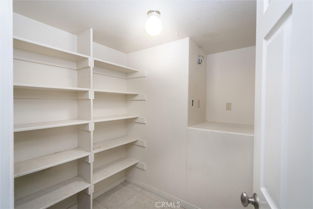 34150 Stowe Road Winchester, CA 92545 - Photo 16 of 80 a view of walk in closet with empty racks