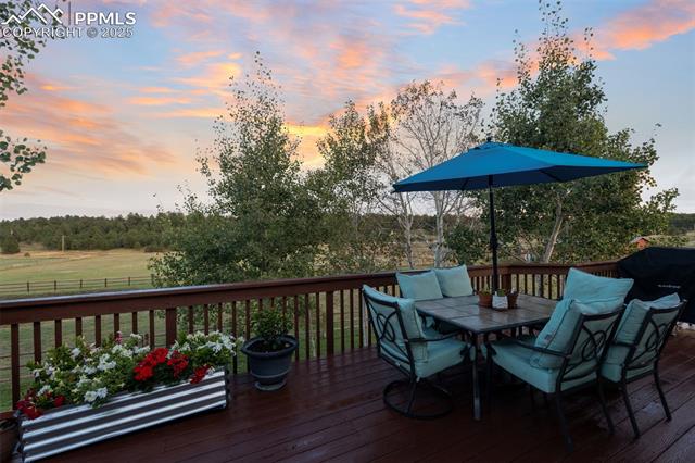 15535 Softwood Road Elbert, CO 80106 - Photo 35 of 47 Wooden terrace with outdoor dining area and area for grilling