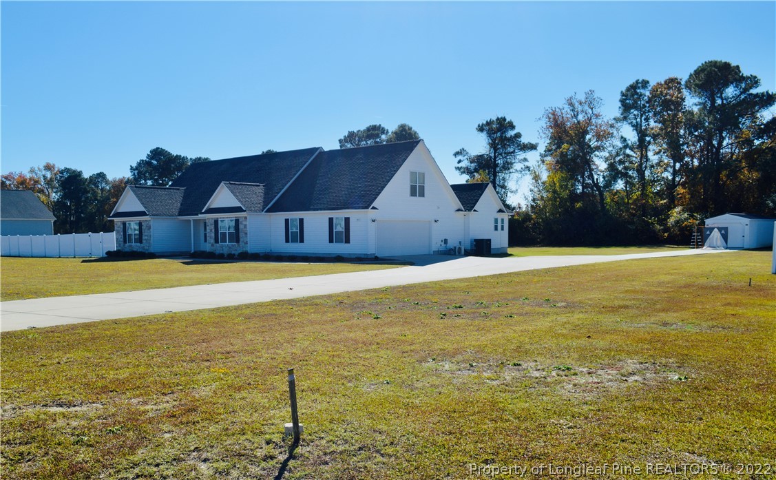 3011 Hayfield Road Wade, NC 28395 - Photo 3 of 15 a view of a swimming pool with an outdoor space and seating area