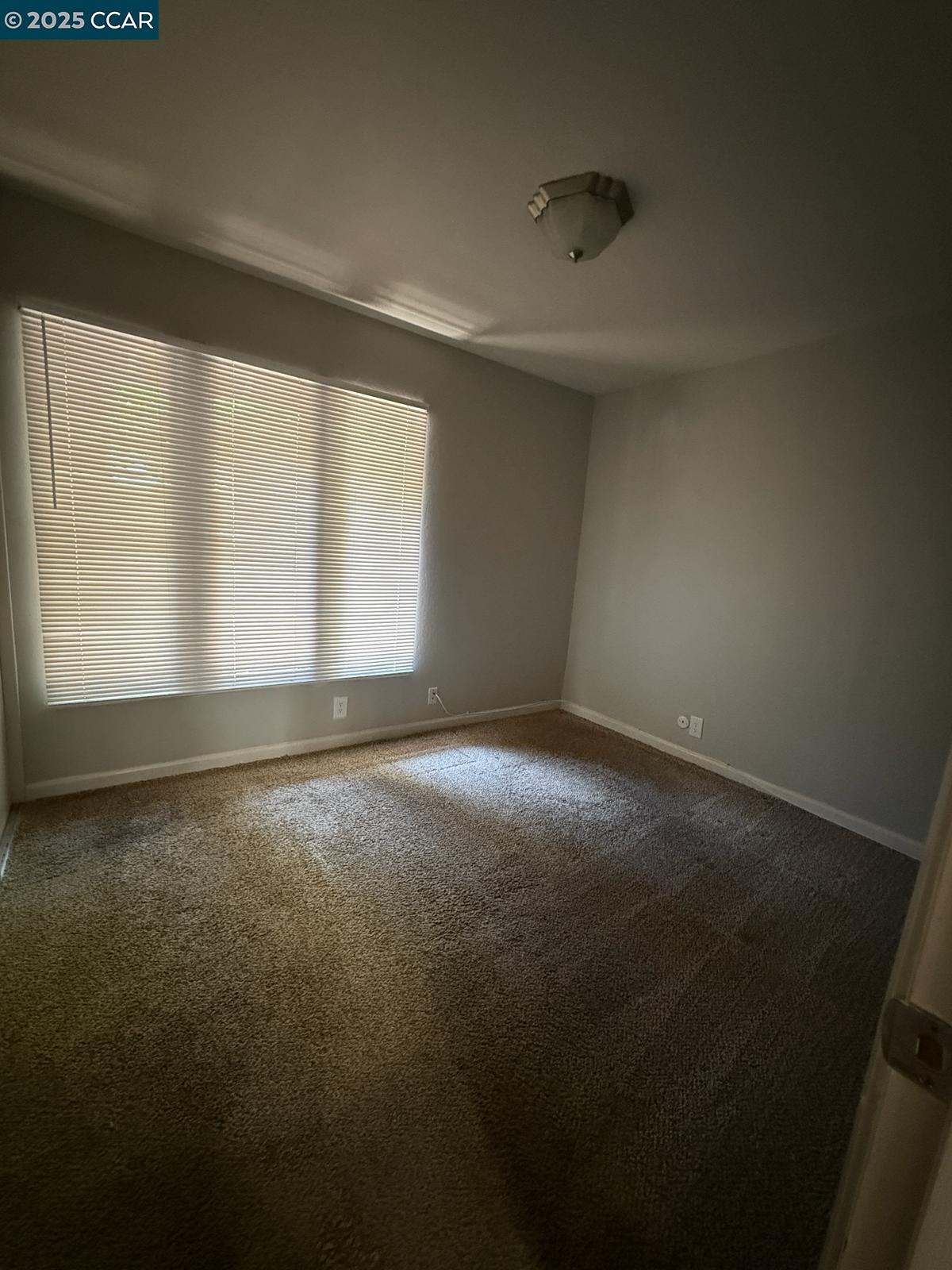 2061 Vanderslice Avenue Walnut Creek, CA 94596 - Photo 13 of 15 an empty room with windows