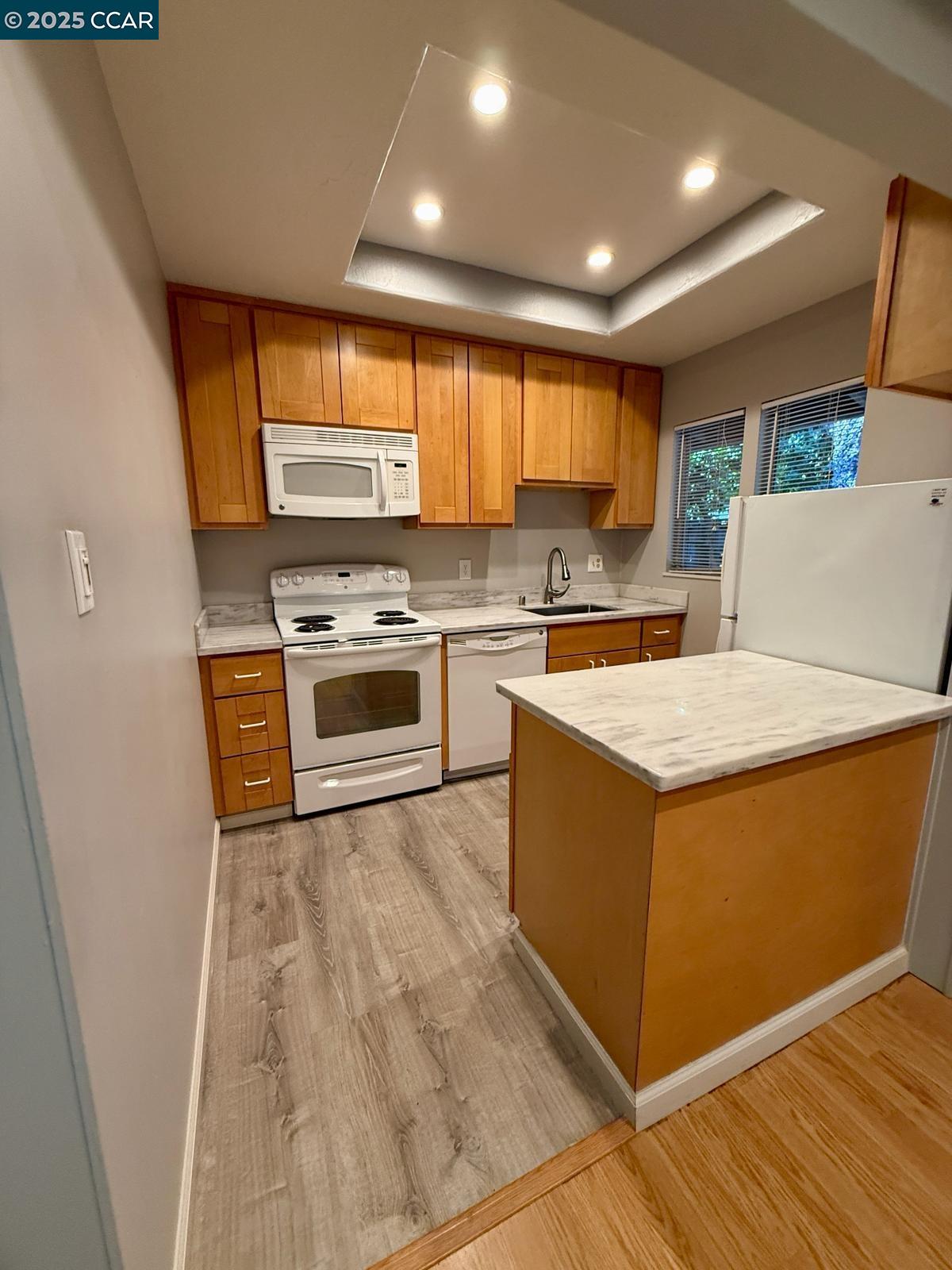 2061 Vanderslice Avenue Walnut Creek, CA 94596 - Photo 4 of 15 a kitchen with a stove and a refrigerator
