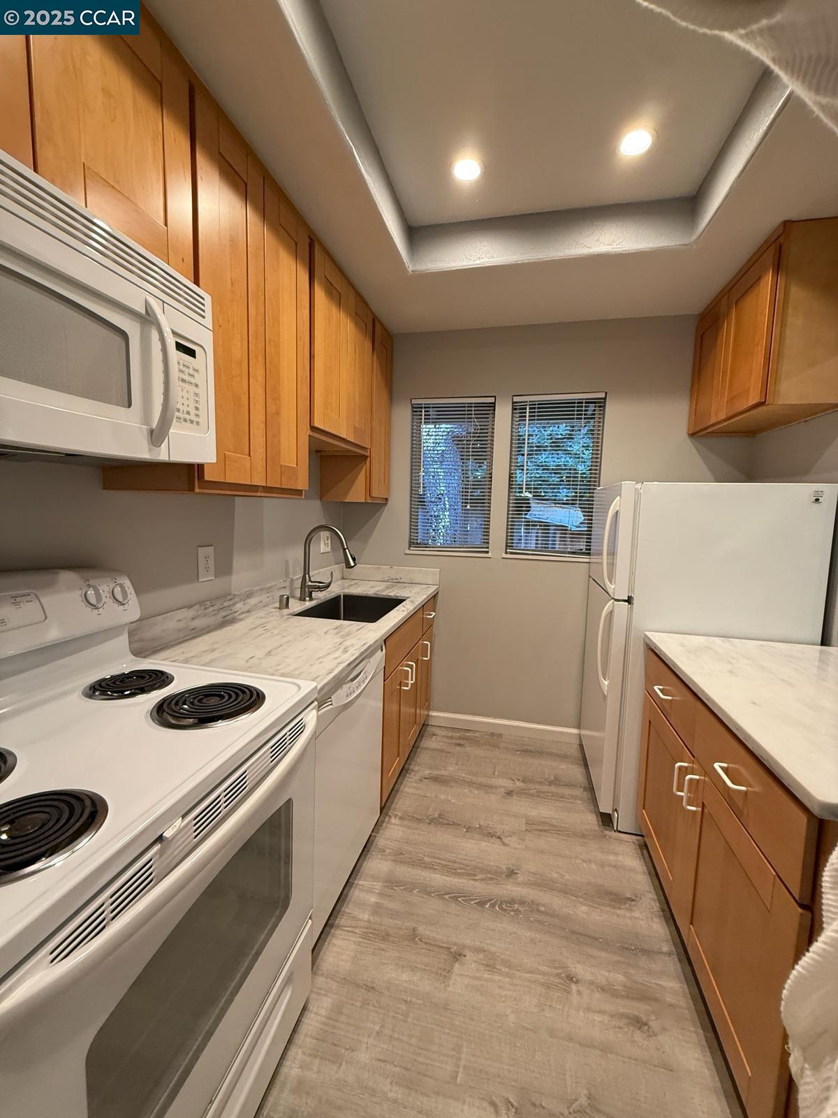 2061 Vanderslice Avenue Walnut Creek, CA 94596 - Photo 5 of 15 a kitchen that has a sink and a stove