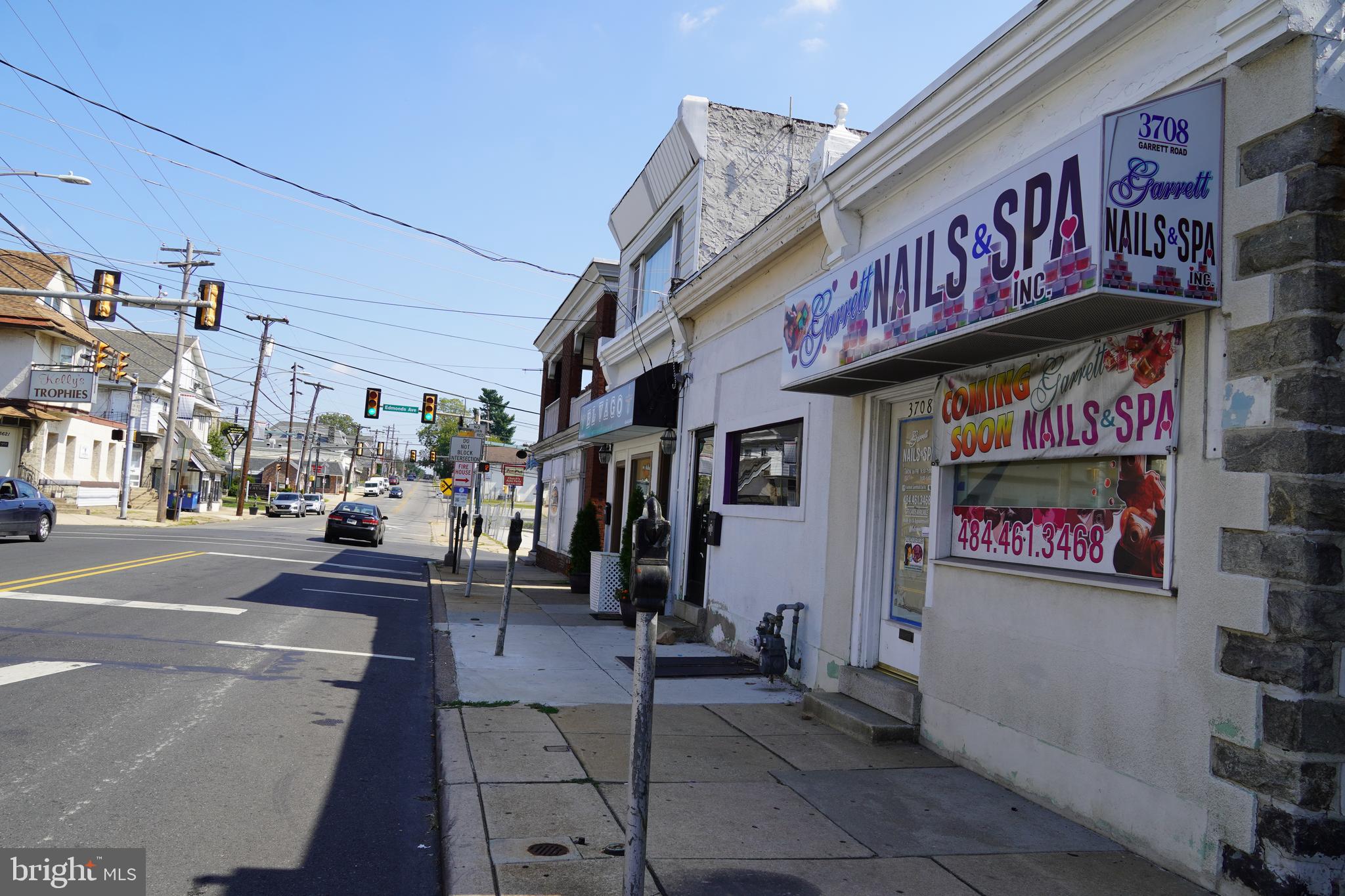 3708 Garrett Road Drexel Hill, PA 19026 - Photo 3 of 12 a view of a street with shops
