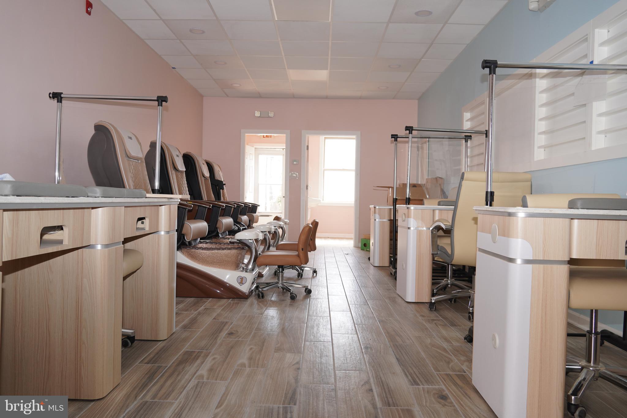 3708 Garrett Road Drexel Hill, PA 19026 - Photo 6 of 12 a living room with furniture a refrigerator and wooden floor