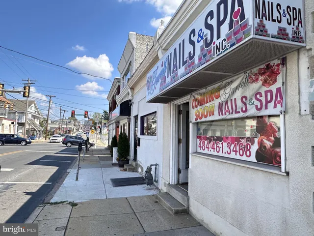 a front view of a building with garage