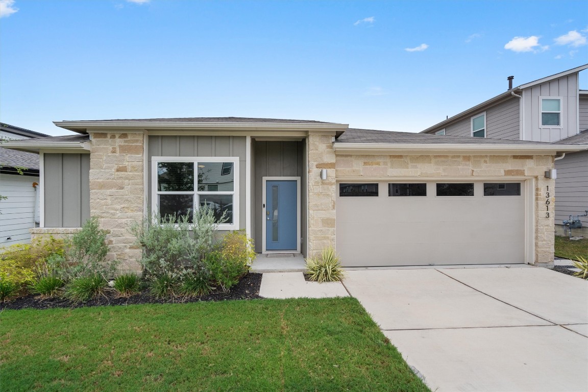 13613 Baileyfield Drive Pflugerville, TX 78660 - Photo 1 of 1 a front view of a house with a garden