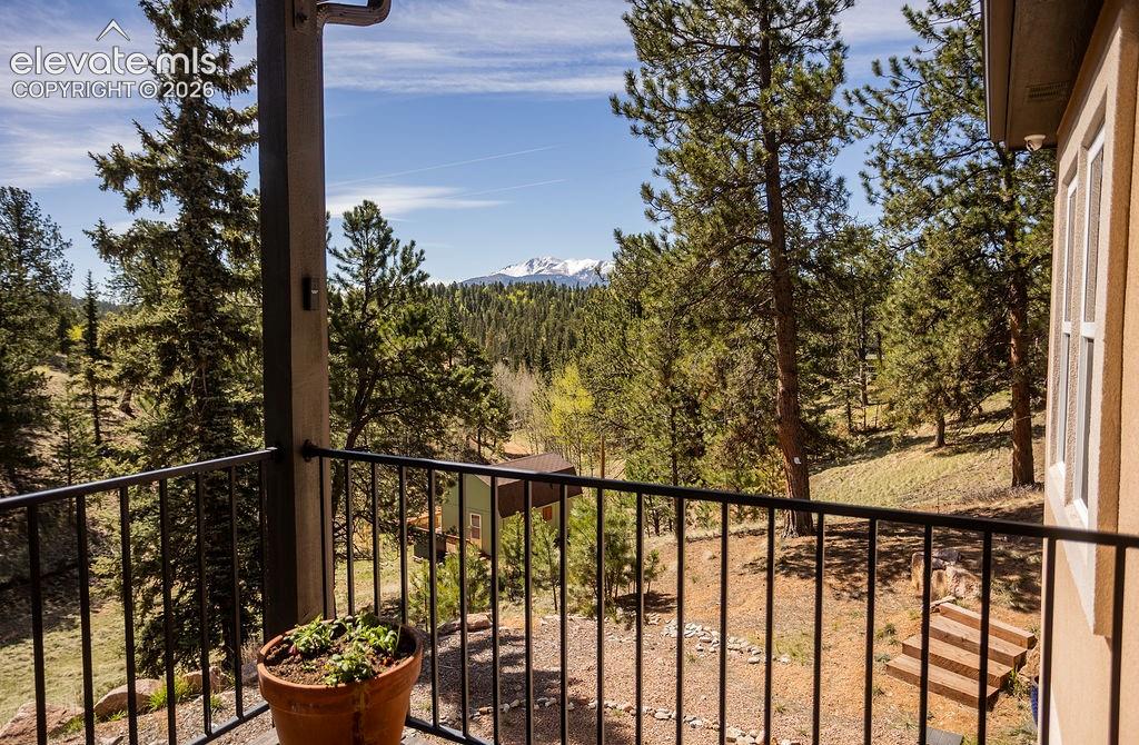 45 Valley Circle Divide, CO 80814 - Photo 32 of 42 a view of a balcony with wooden chairs