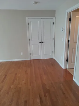 a view of room with hardwood floor