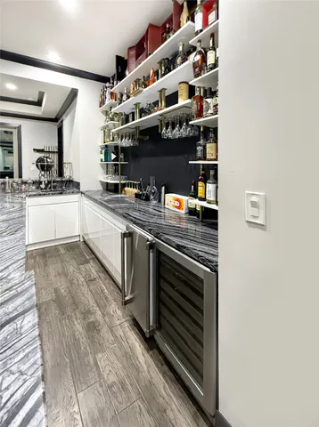 a kitchen with stainless steel appliances and cabinets