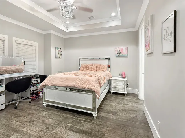 a bathroom with a bathtub shower sink vanity and toilet