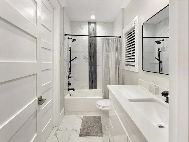 a utility room with sink dryer and washer