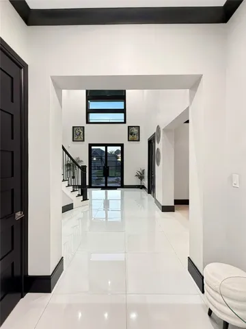 a view of a hallway with a living room