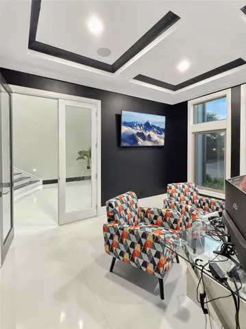 a bedroom with bed and glass door