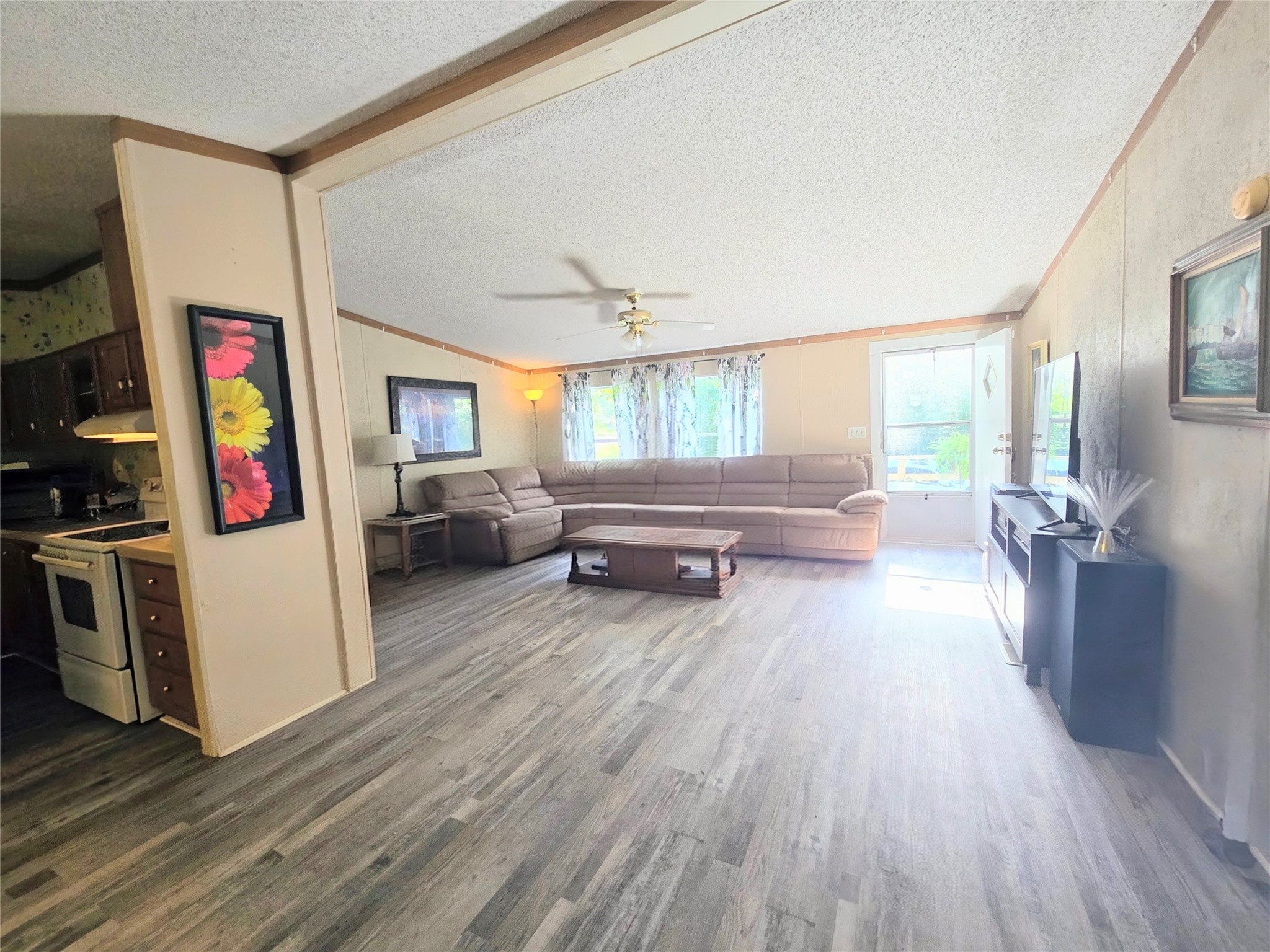118 Noel Livingston, TX 77351 - Photo 2 of 13 a living room with furniture and a wooden floor