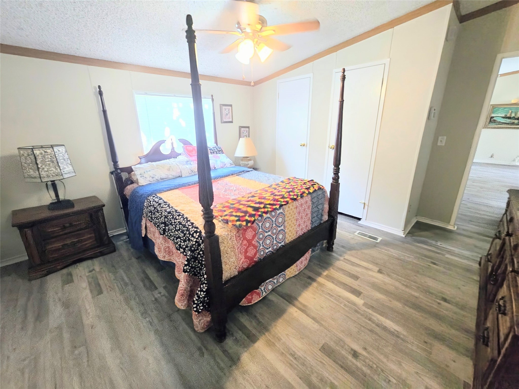 118 Noel Livingston, TX 77351 - Photo 5 of 13 a bed sitting in a bedroom next to a window