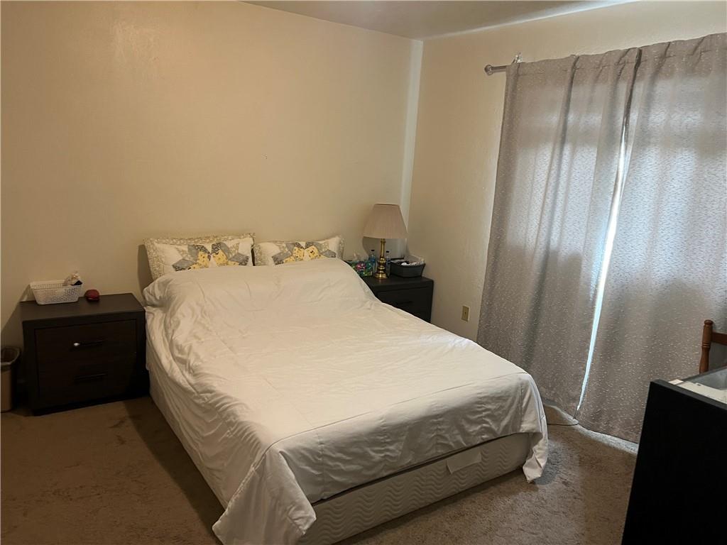 309 Magazine Street Carnegie, PA 15106 - Photo 9 of 18 a bedroom with a bed and a closet