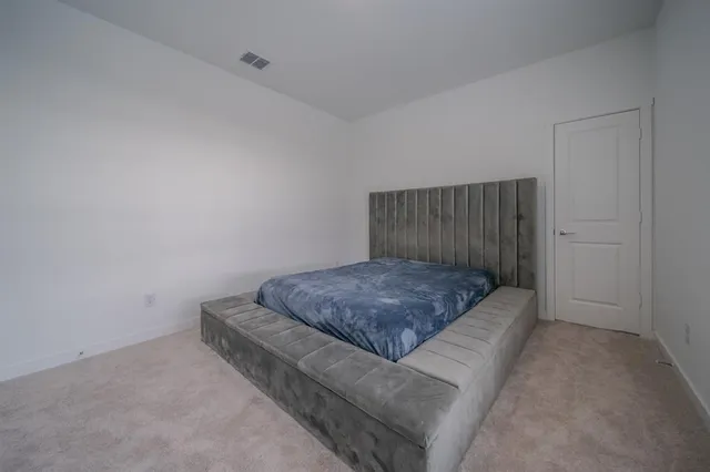 a living room with a couch and a rug