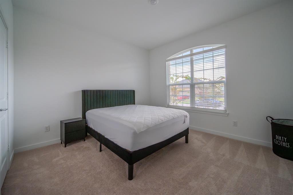 3617 Swan Shadow Mesquite, TX 75181 - Photo 19 of 21 a bedroom with a bed chair and a window