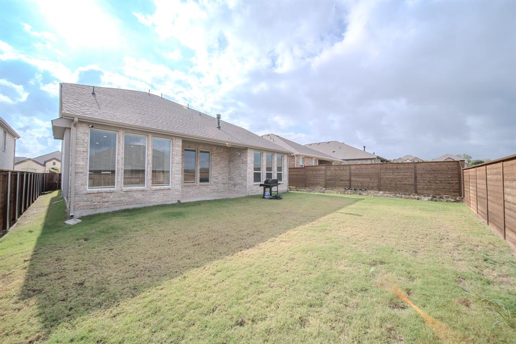 3617 Swan Shadow Mesquite, TX 75181 - Photo 20 of 21 a view of a house with backyard and wooden fence