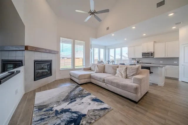 a living room with furniture and a fireplace