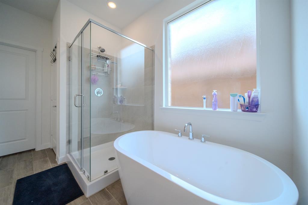 3617 Swan Shadow Mesquite, TX 75181 - Photo 10 of 21 a bathroom with a bathtub and a shower