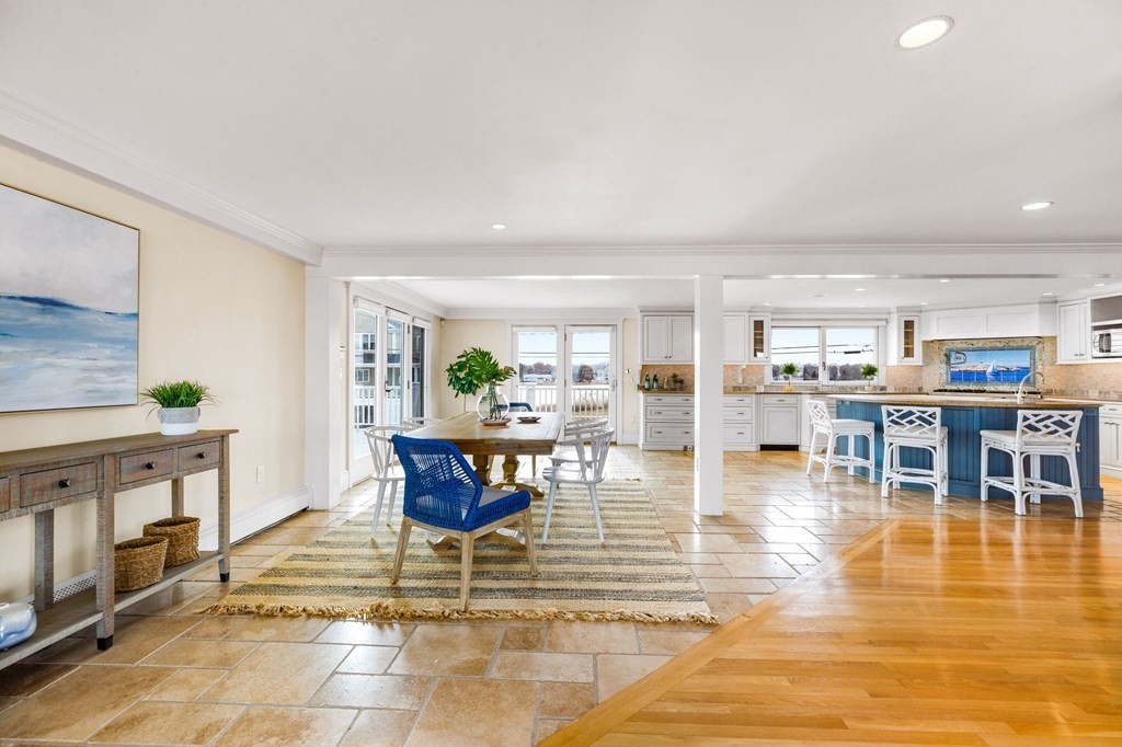 67 Surfside Road Scituate, MA 02066 - Photo 13 of 41 a living room with furniture a dining table and a coffee table