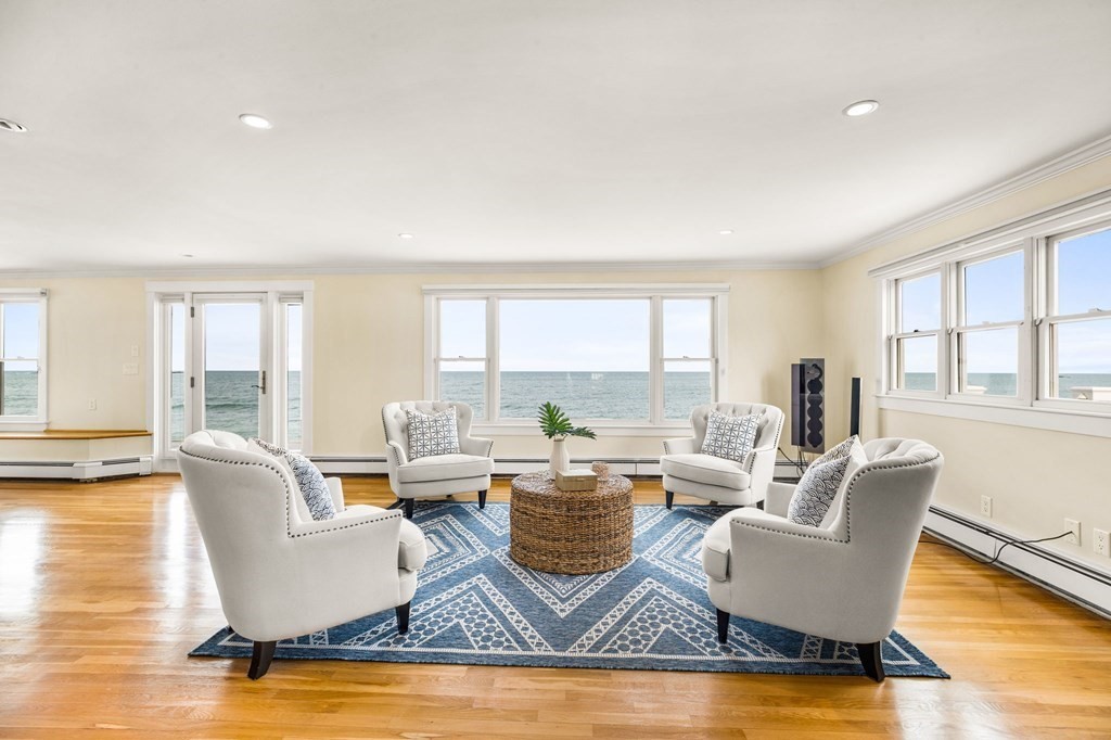 67 Surfside Road Scituate, MA 02066 - Photo 17 of 41 a living room with fireplace furniture and a large window