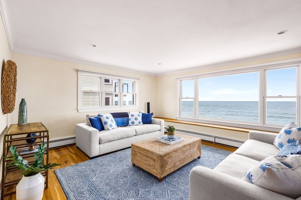 67 Surfside Road Scituate, MA 02066 - Photo 21 of 41 a living room with furniture and a floor to ceiling window