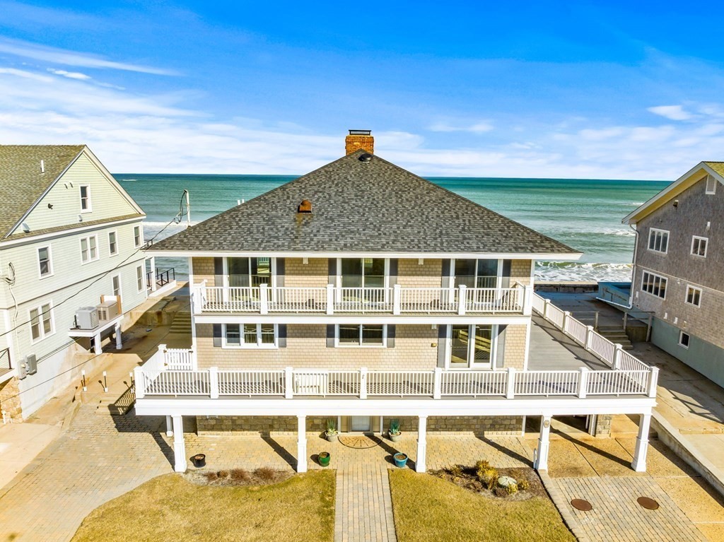 67 Surfside Road Scituate, MA 02066 - Photo 3 of 41 a front view of a house with a yard