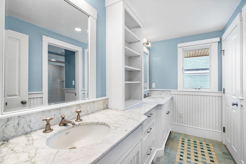 67 Surfside Road Scituate, MA 02066 - Photo 33 of 41 a bathroom with a sink a vanity and a mirror