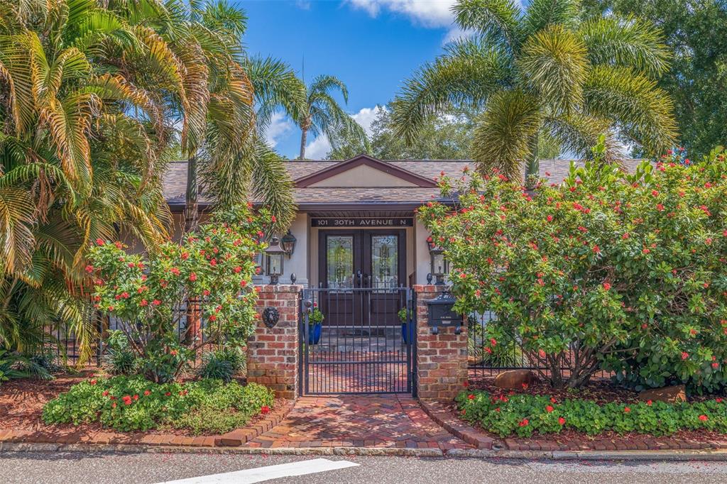 101 30th Avenue North St. Petersburg, FL 33704 - Photo 1 of 67 a front view of a house with garden