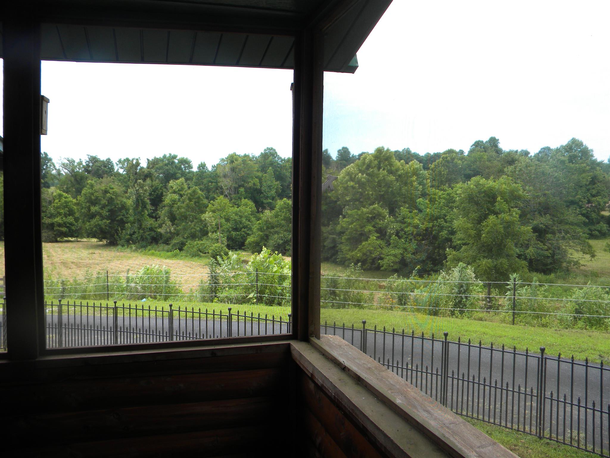 109 Scott Road Hohenwald, TN 38462 - Photo 17 of 30 Beautiful valley view out of screened porch. Screened in attached porch with a small area fenced in for possible pets.