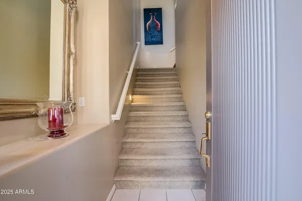 a view of a hallway with wooden floor and entryway