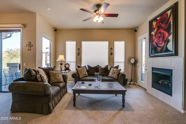 a living room with furniture and a fireplace
