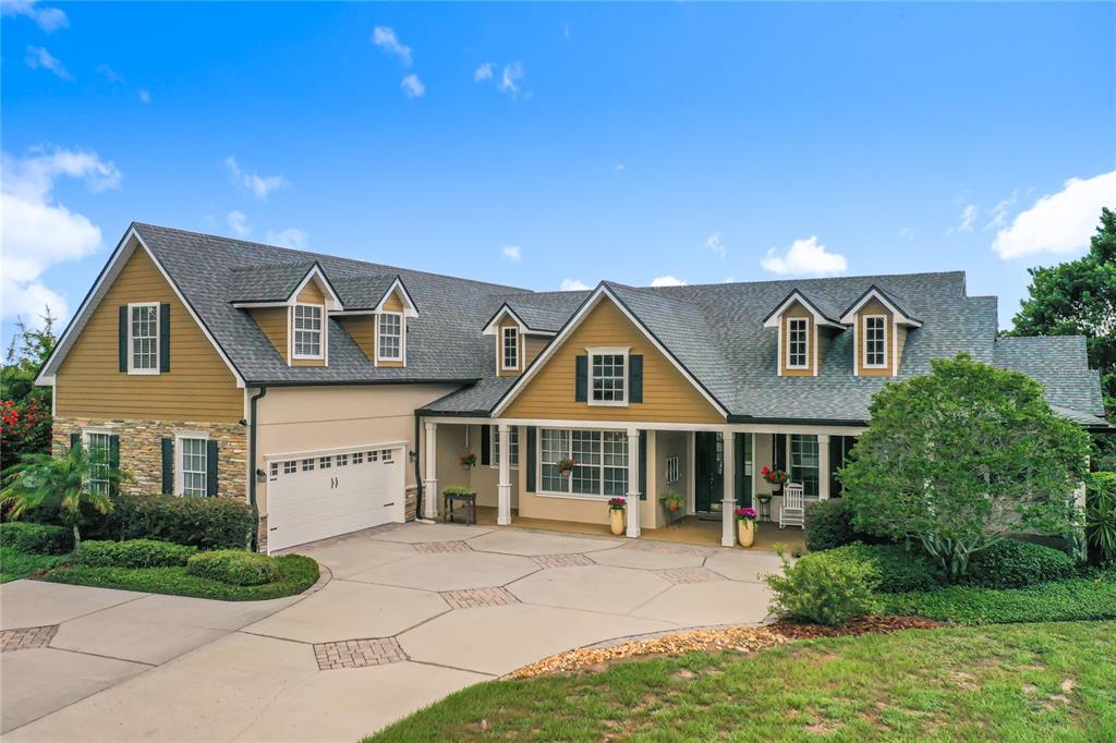 3040 Lakeshore Boulevard St. Cloud, FL 34769 - Photo 1 of 1 a front view of a house with a yard
