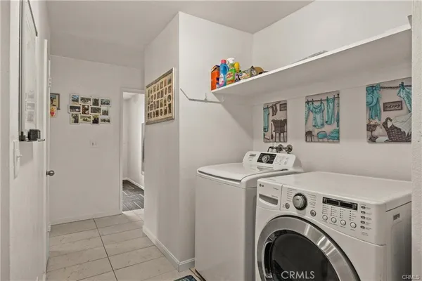 a view of livingroom with washer and dryer