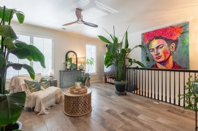 a kitchen with granite countertop a sink a stove top oven a counter space and cabinets