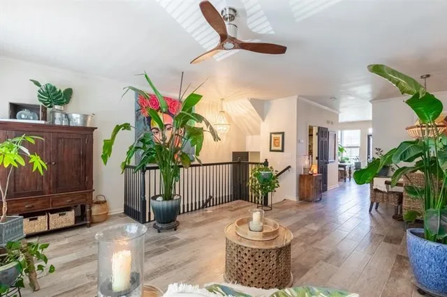 a kitchen with stainless steel appliances granite countertop a stove sink microwave and window