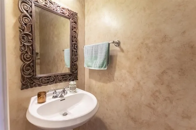a kitchen with stainless steel appliances granite countertop a stove sink and cabinets