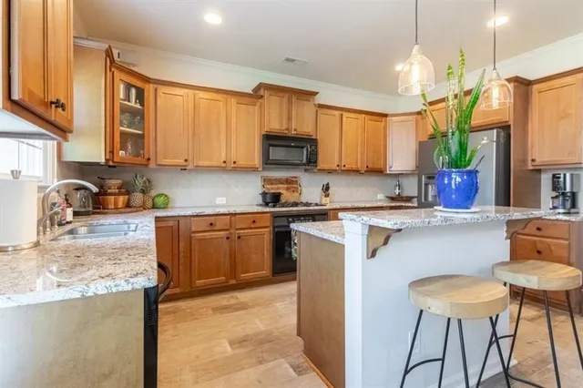 a view of a chairs and table on the deck