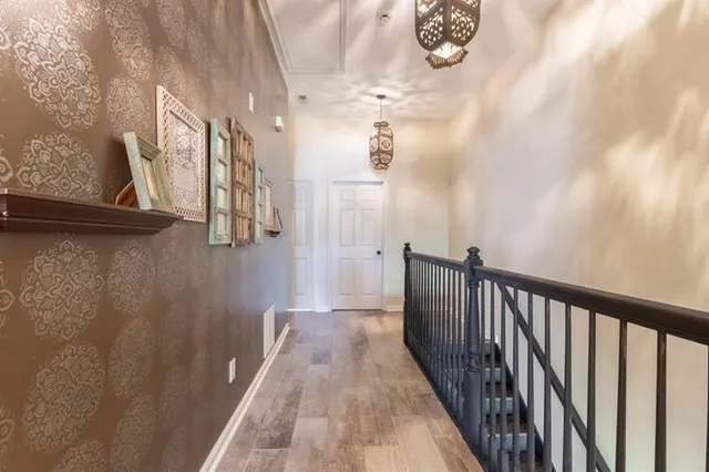 a white bath tub sitting in a bathroom next to a window