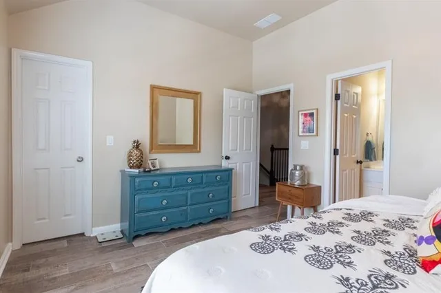 an aerial view of a residential houses with outdoor space and parking