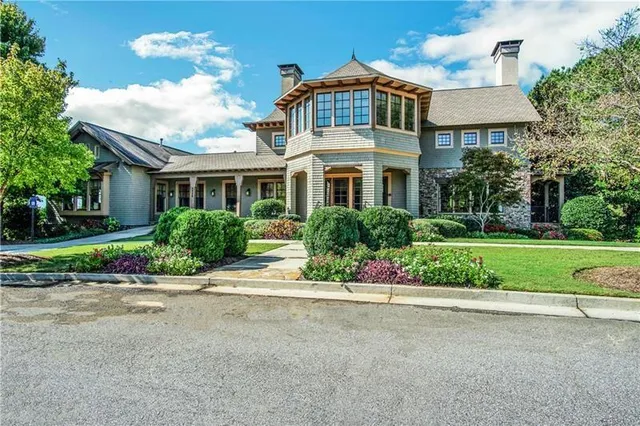 a view of a swimming pool with a yard