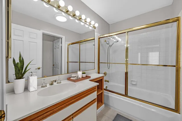 a bathroom with a sink and shower