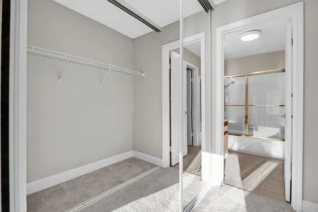 a bathroom with a glass shower door
