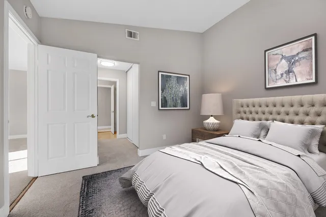 a view of a balcony with wooden floor and fence