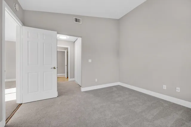 a view of a brick house with many windows