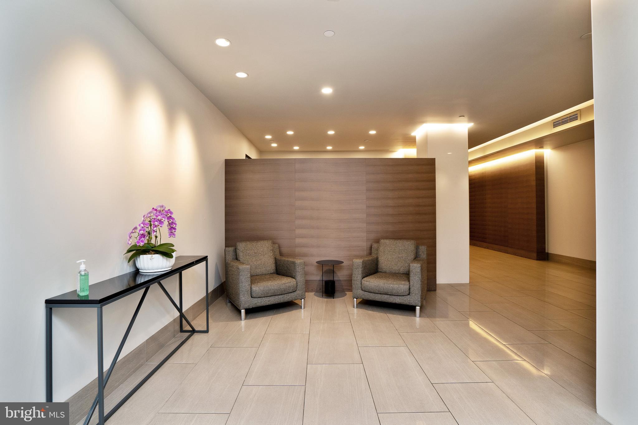 2020 Walnut Street, Unit 5M Philadelphia, PA 19103 - Photo 12 of 15 a lobby with furniture and stairs