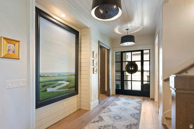 3 Carriagewood Cove, Unit 1088 Sandy, UT 84092 - Photo 8 of 79 Entryway featuring a grid-paneled glass door with sidelights, wood-finish flooring, and shiplap ceiling