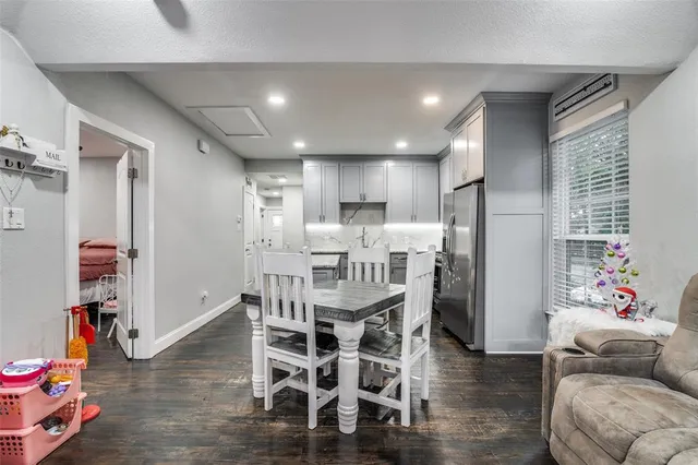 a living room with furniture and kitchen view